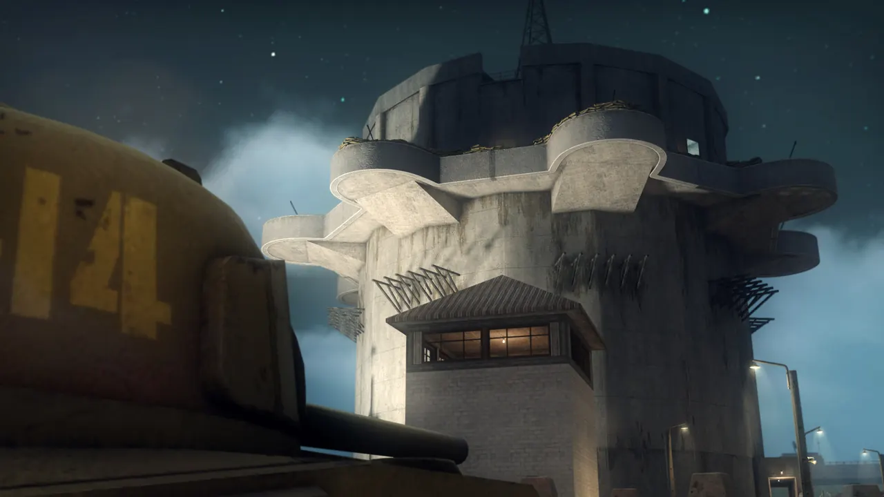 A huge concrete flak tower at dusk seen from behind a tank turret